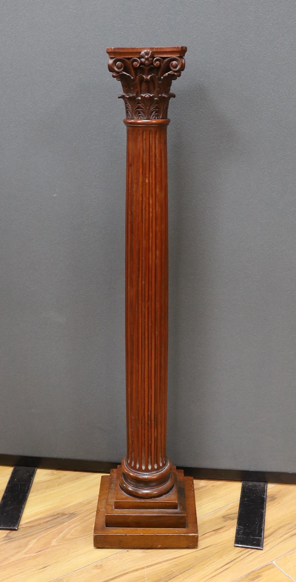An early 20th century carved walnut Corinthian column, 80cm high
